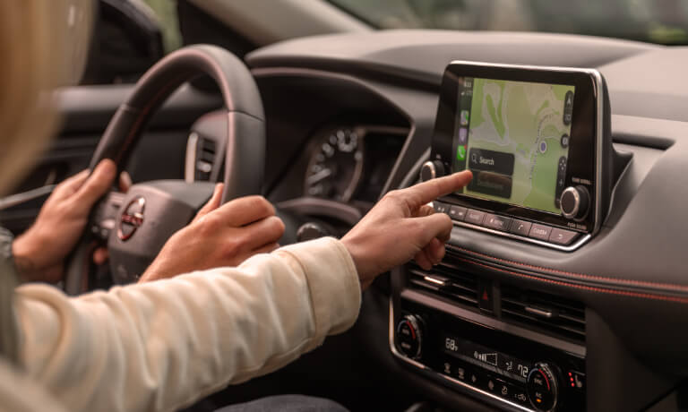 2026.5 Nissan Rogue infotainment system with passengers